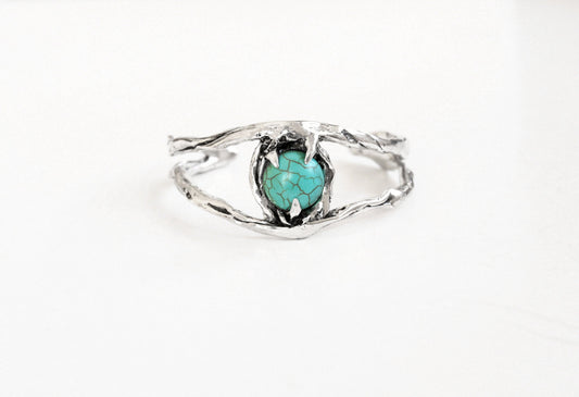 Silver cuff bracelet with a turquoise stone