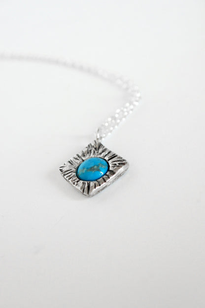 Silver necklace with a turquoise stone pendant 