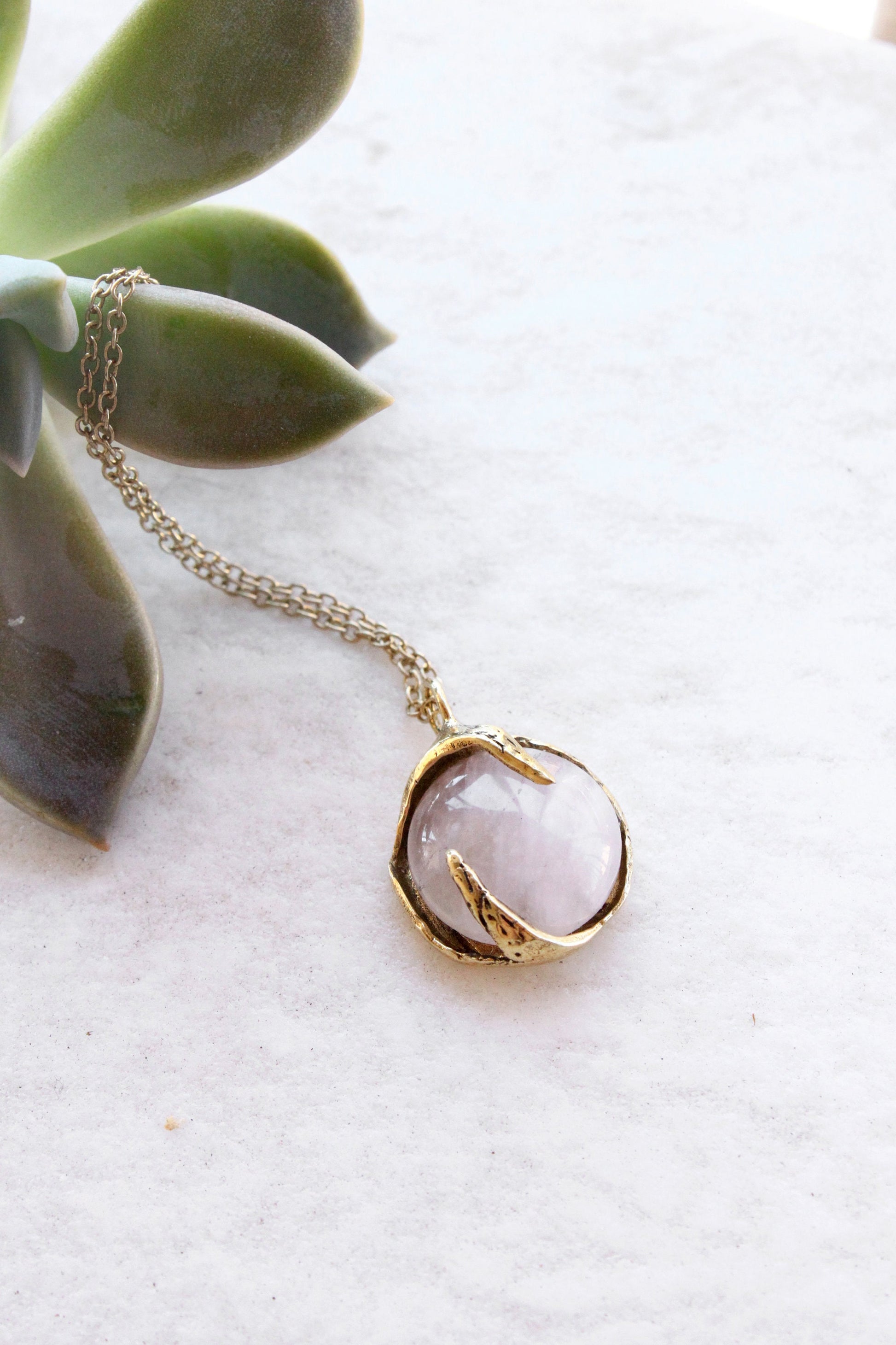 Necklace with a rose quartz stone pendant 