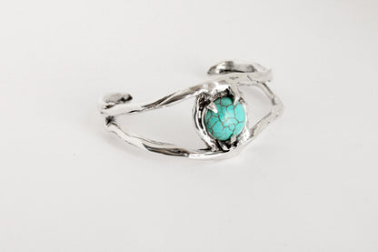 Silver bracelet with a turquoise stone