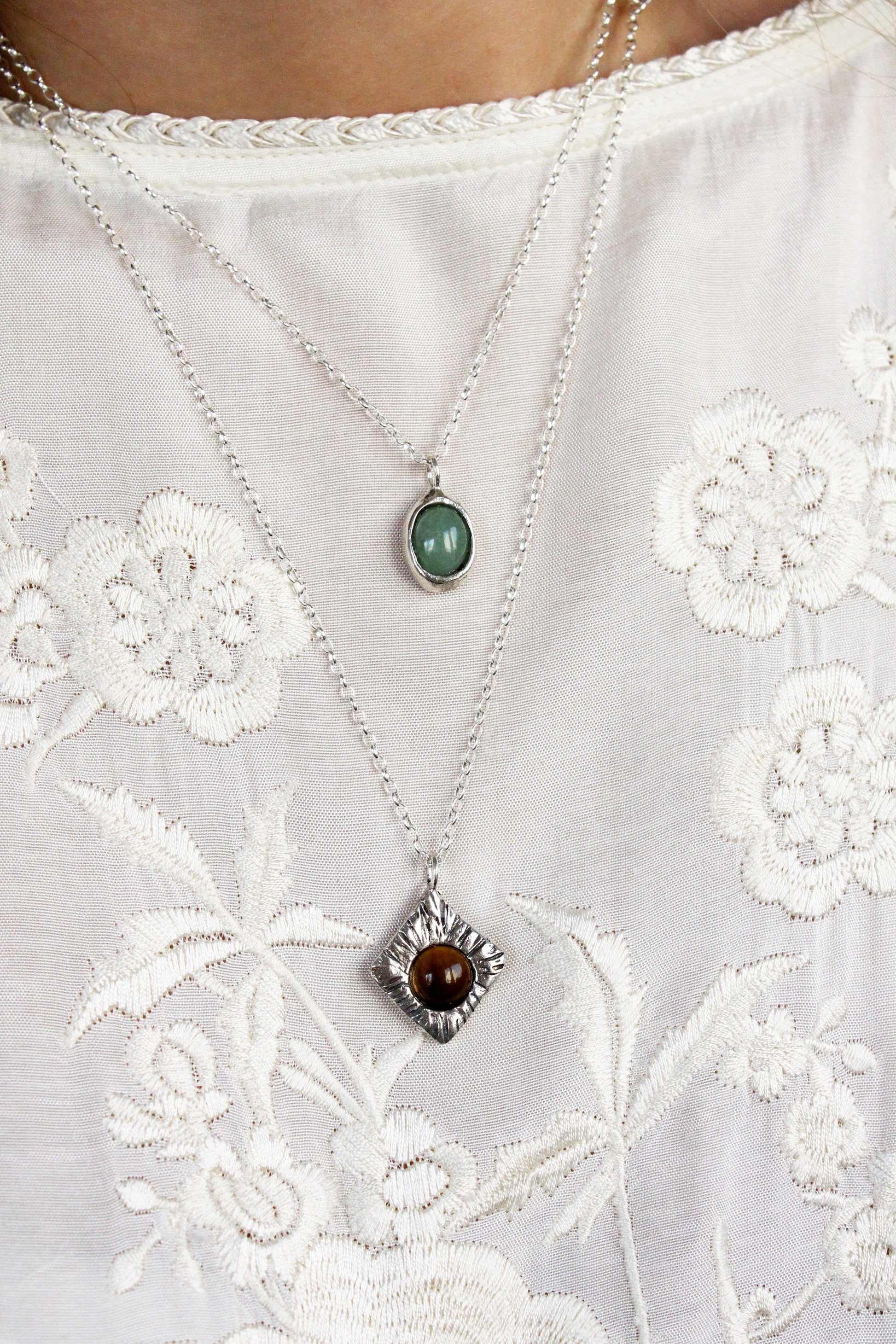Two necklaces with stones tigers eye