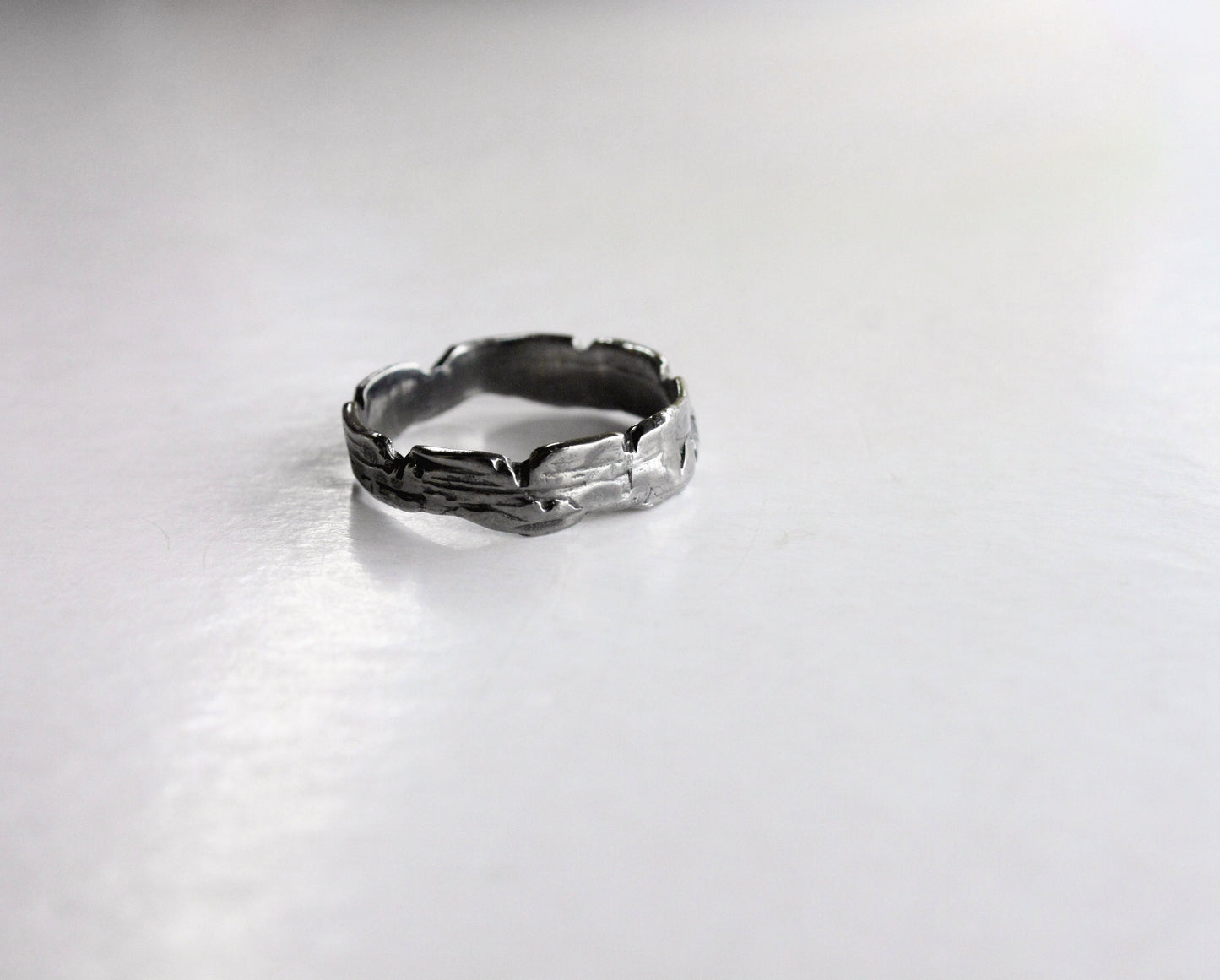 Silver skinny ring with a textured design 