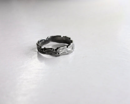 Silver skinny ring with a textured design 