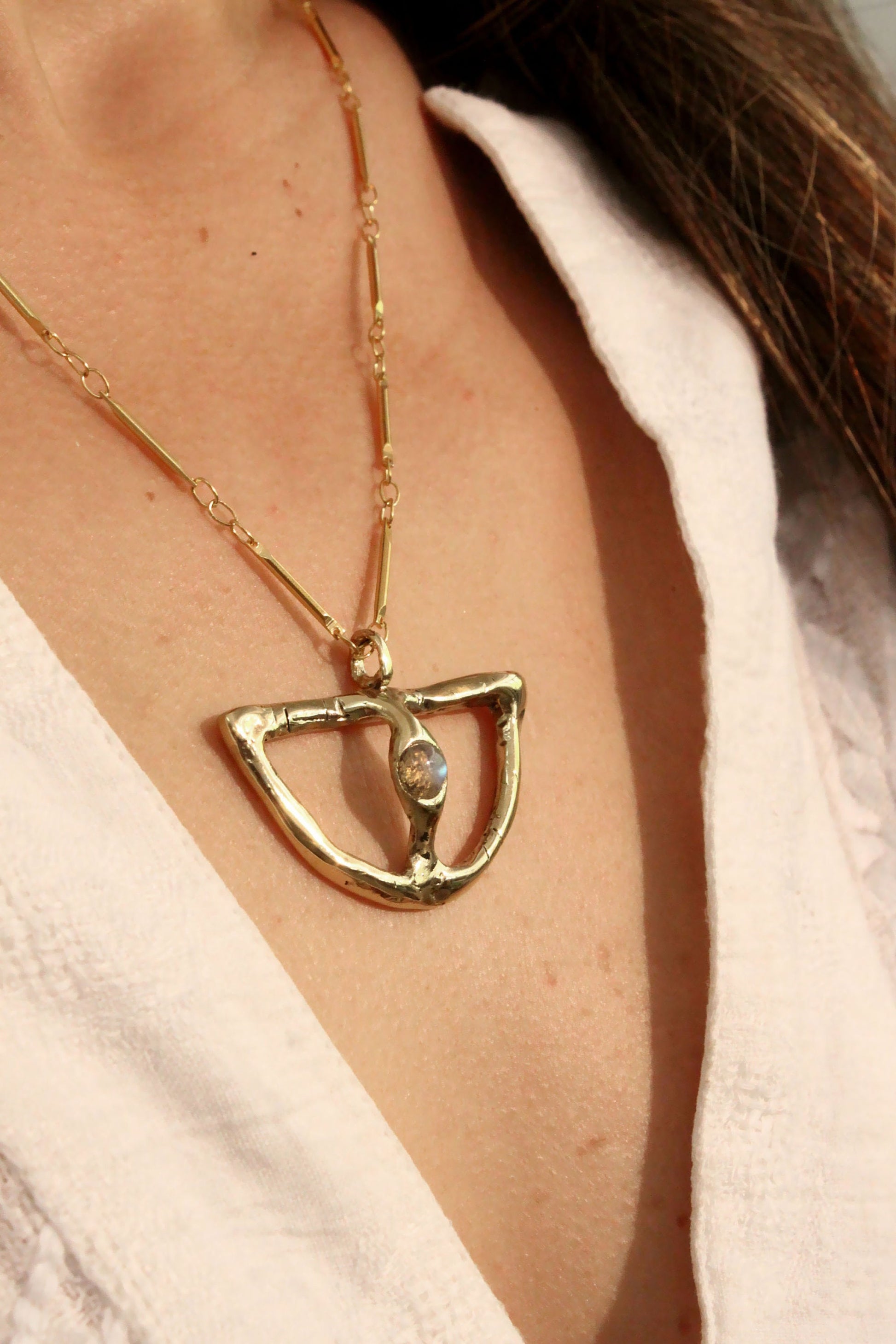 Gold necklace with a moonstone pendant 