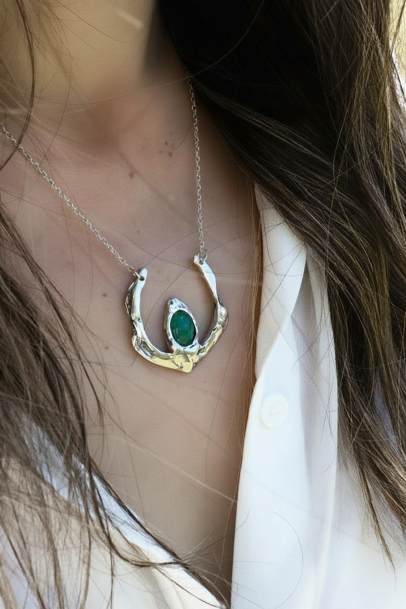 Necklace with a green pendant