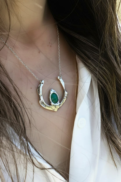Necklace with a green pendant
