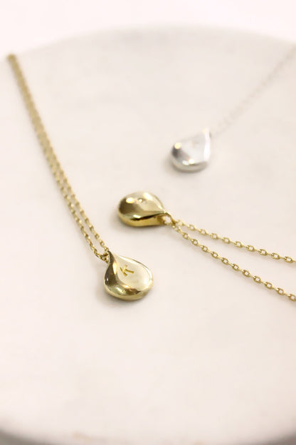 Gold necklace with teardrop pendants monogram