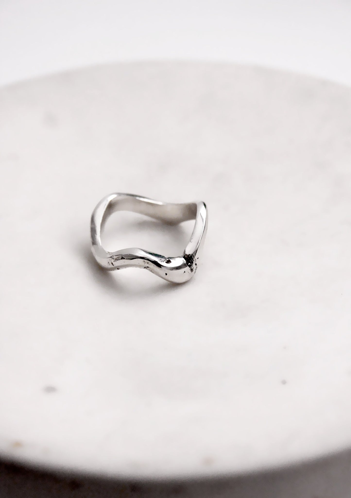 Silver wavy molten liquid ring minimal