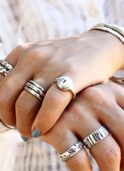 multiple silver rings 