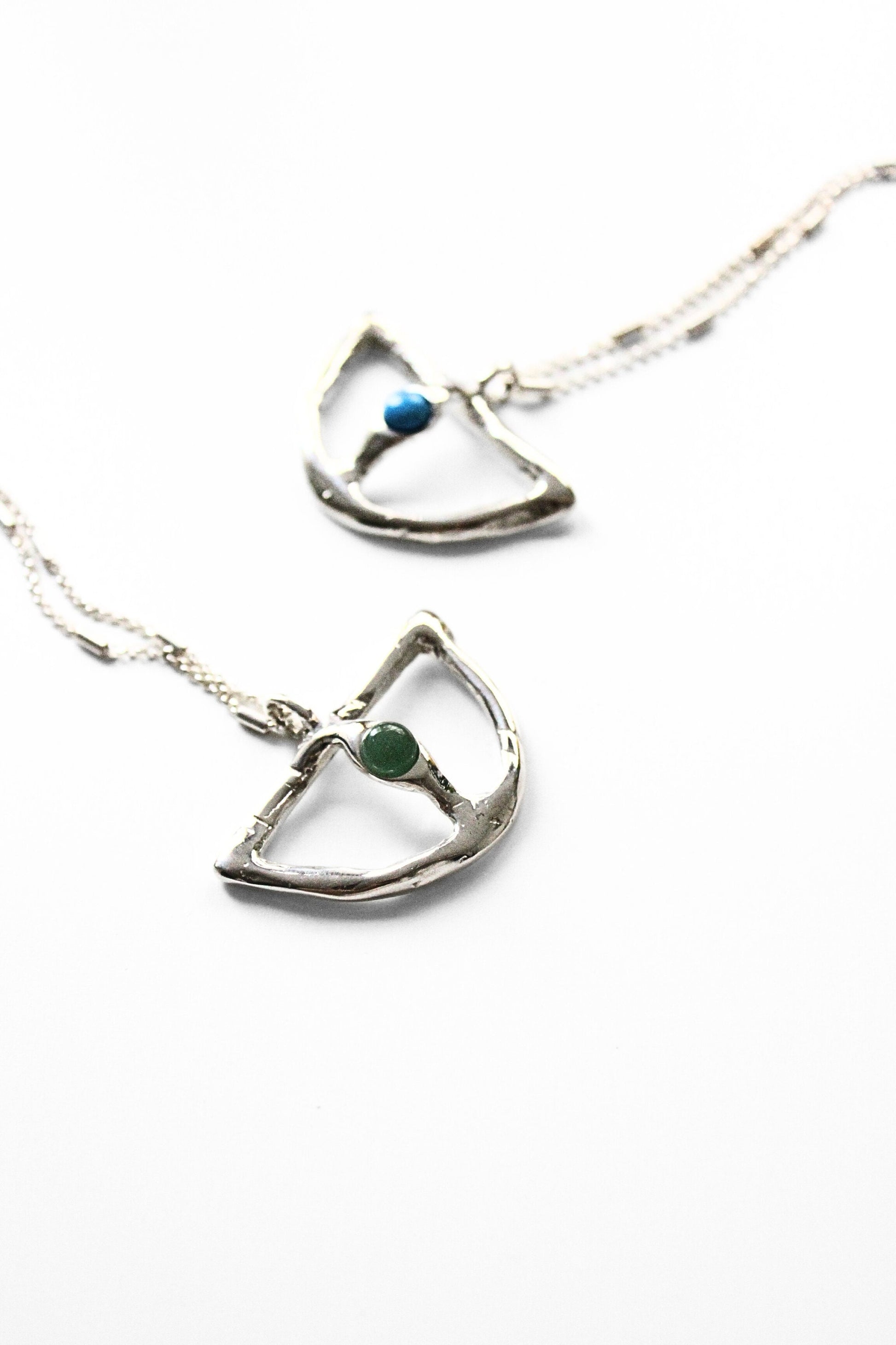 Two silver necklaces with gemstones