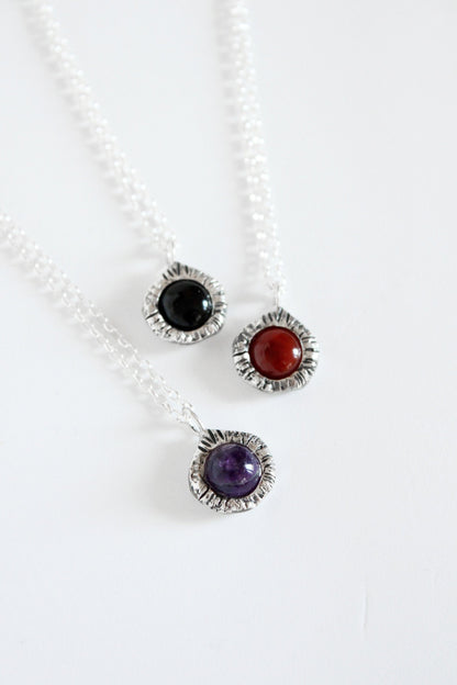 Gemstone pendants with black onyx crystal, amethyst and carnelian.